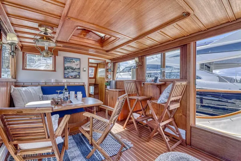 Slide: The Image of Luxurious 1981 Nielsen 46 yacht interior with wooden decor and comfortable seating. - 5