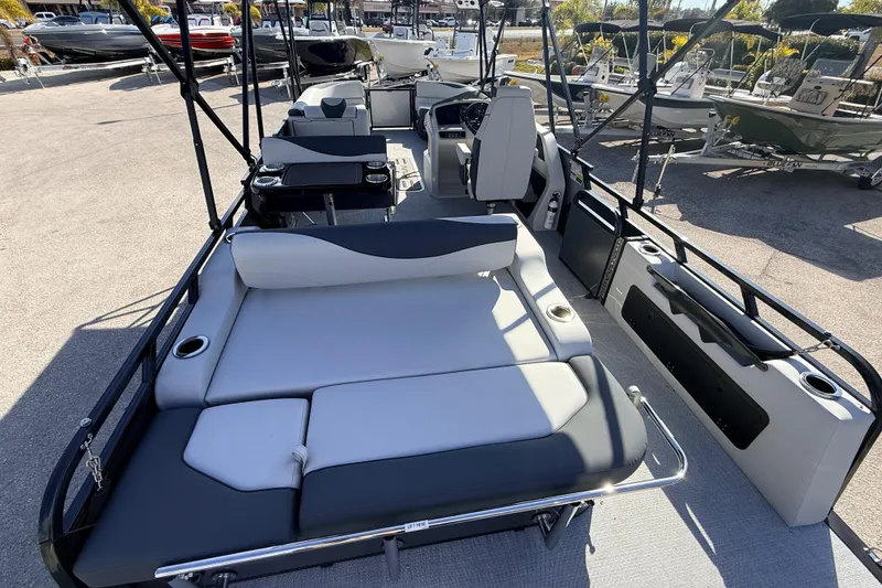 Slide: The Image of 2026 Avalon 2585 LSZ Entertainer Tri Toon boat with luxurious seating and modern design. - 14