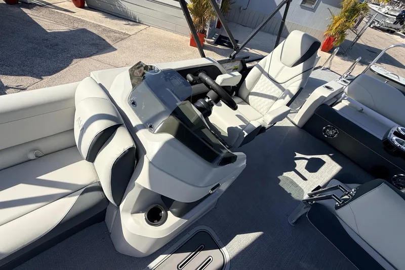 Slide: The Image of 2026 Avalon 2585 LSZ Entertainer boat interior with modern helm and seating. - 21