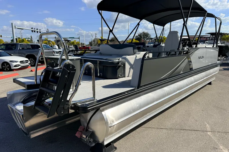 Slide: The Image of 2026 Avalon 2585 LSZ Entertainer Tri Toon boat with swing back, high performance design. - 6