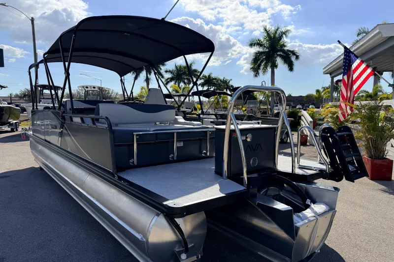 Slide: The Image of 2026 Avalon 2585 LSZ Entertainer Tri Toon boat with American flag, sunny day. - 10