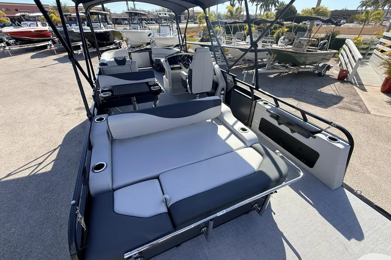 Slide: The Image of 2026 Avalon 2585 LSZ Entertainer Tri Toon boat with luxurious seating and modern design. - 13