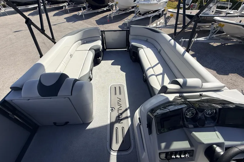 Slide: The Image of 2026 Avalon 2585 LSZ Entertainer boat interior with spacious seating and modern dashboard. - 16
