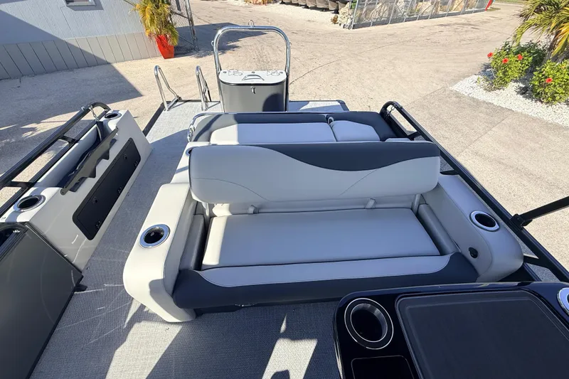 Slide: The Image of 2026 Avalon 2585 LSZ Entertainer boat interior with seating and cup holders. - 23