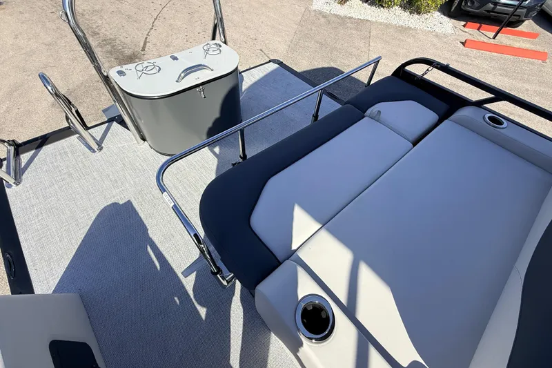 Slide: The Image of 2026 Avalon 2585 LSZ Entertainer boat interior with seating and control panel. - 30