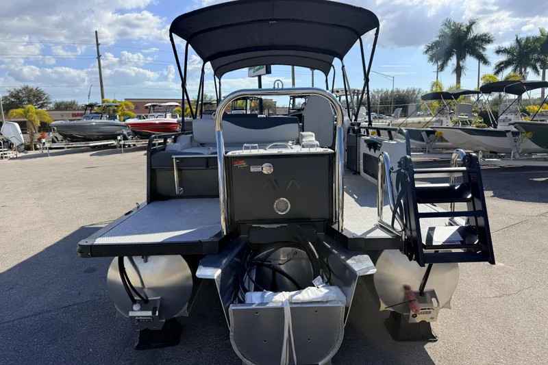 Slide: The Image of 2026 Avalon 2585 LSZ Entertainer Tri Toon boat with high performance features, docked outdoors. - 9