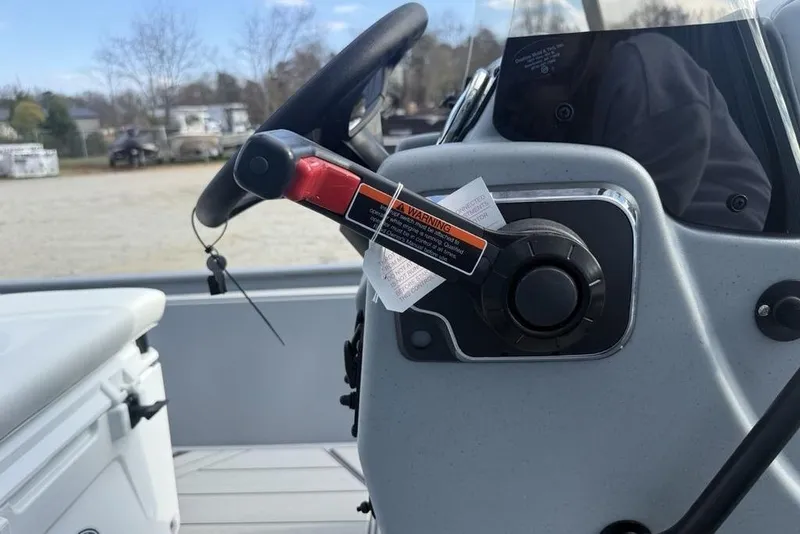 Slide: The Image of 2026 Tracker Bass Tracker Classic CC steering console with warning label. - 11