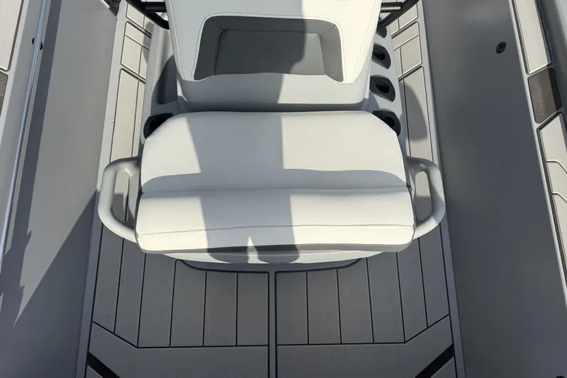 Slide: The Image of 2026 Tracker Bass Tracker Classic CC boat interior with white seating and gray flooring. - 15