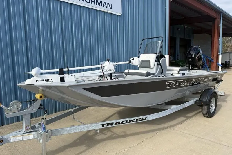 The Image of 2026 Tracker Bass Tracker Classic CC boat on trailer, featuring Minn Kota Maxxum motor. - 2
