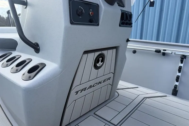 Slide: The Image of 2026 Tracker Bass Tracker Classic CC boat console with rod holders and control panel. - 24