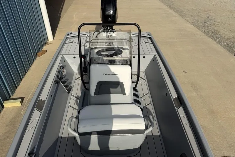 Slide: The Image of 2026 Tracker Bass Tracker Classic CC boat interior with steering console and seating. - 8