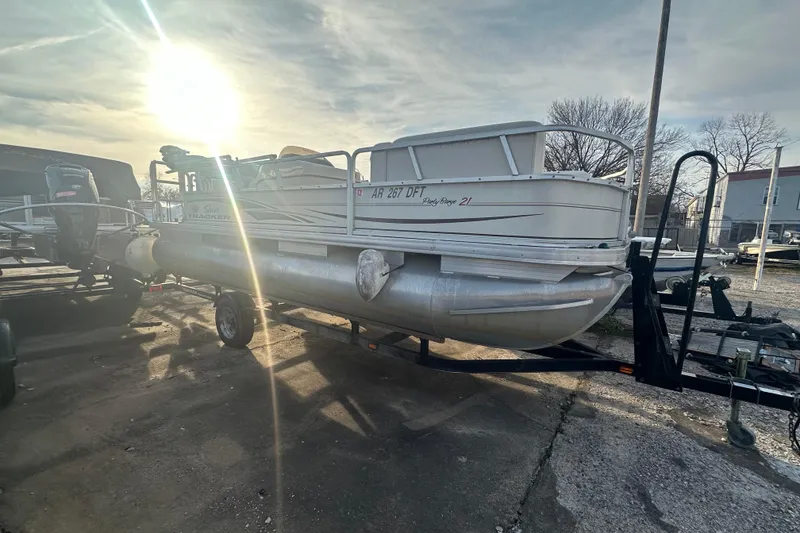 The Image of 2006 Sun Tracker Party Barge 21 Signature Series pontoon boat on trailer, sunlit background. - 0