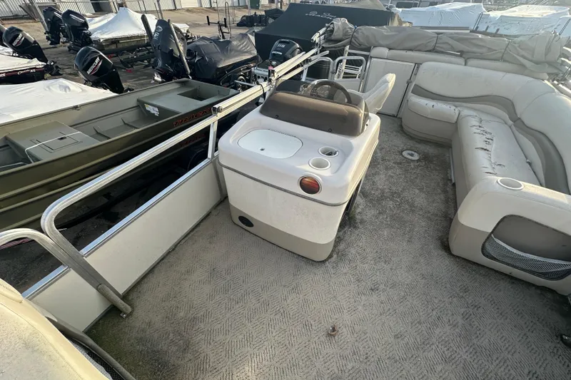 Slide: The Image of 2006 Sun Tracker Party Barge 21 Signature Series interior with seating and console. - 16