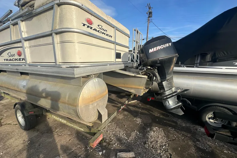 Slide: The Image of 2006 Sun Tracker Party Barge 21 Signature Series with Mercury outboard motor on trailer. - 6