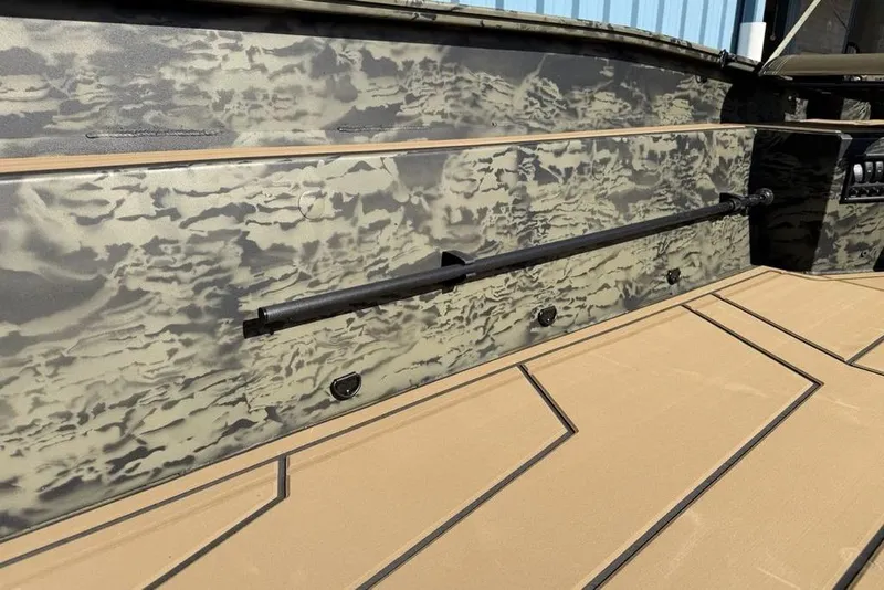 Slide: The Image of 2026 Tracker Grizzly 1650 T Prairie Wings Edition boat interior with camouflage design. - 10