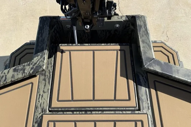 Slide: The Image of Tracker Grizzly 1650 T Prairie Wings Edition 2026 boat deck with camouflage design. - 12