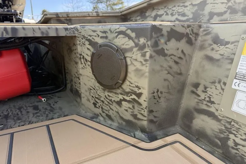Slide: The Image of 2026 Tracker Grizzly 1650 T Prairie Wings Edition interior with camouflage design. - 13