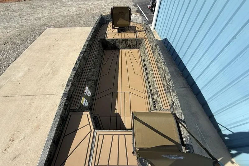 Slide: The Image of 2026 Tracker Grizzly 1650 T Prairie Wings Edition boat with camo design and spacious interior. - 16