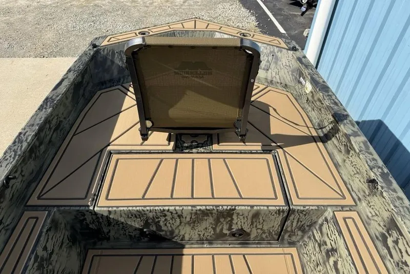 Slide: The Image of 2026 Tracker Grizzly 1650 T Prairie Wings Edition boat interior with camouflage design and seating. - 3