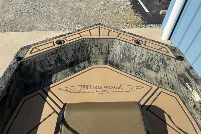 Slide: The Image of 2026 Tracker Grizzly 1650 T Prairie Wings Edition boat interior with camouflage design. - 4