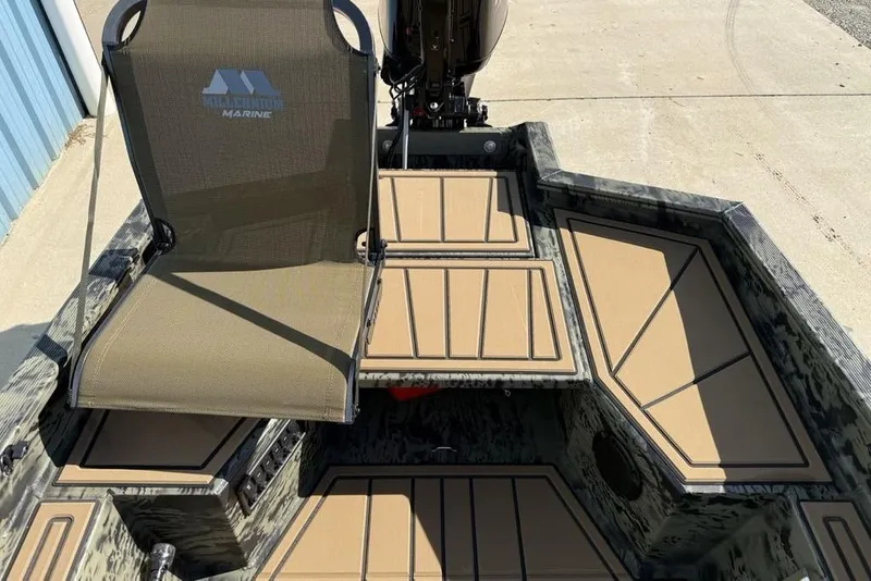 Slide: The Image of 2026 Tracker Grizzly 1650 T Prairie Wings Edition boat interior with seating and deck. - 7