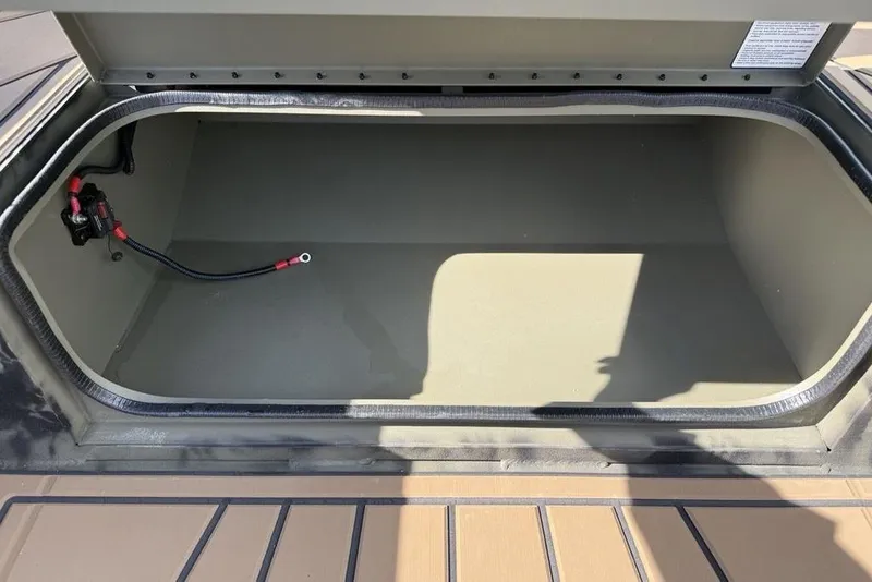 Slide: The Image of Open storage compartment of 2026 Tracker Grizzly 1650 T Prairie Wings Edition boat. - 9