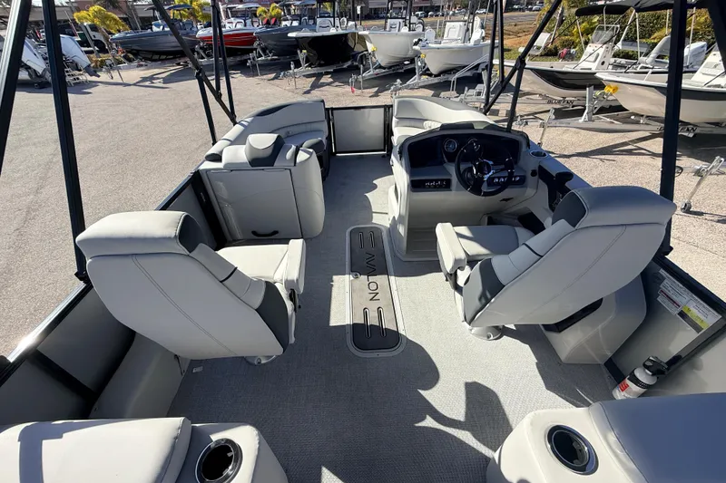 Slide: The Image of 2026 Avalon 2385 LSZ Quad Lounger Tri Toon boat interior with luxurious seating and steering console. - 12