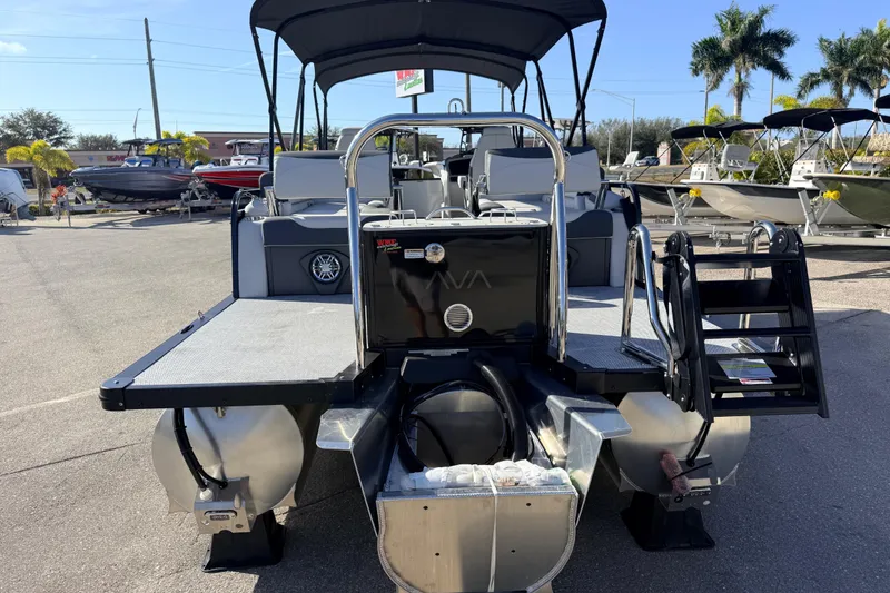 Slide: The Image of 2026 Avalon 2385 LSZ Quad Lounger Tri Toon boat, high performance, rear view in marina. - 7