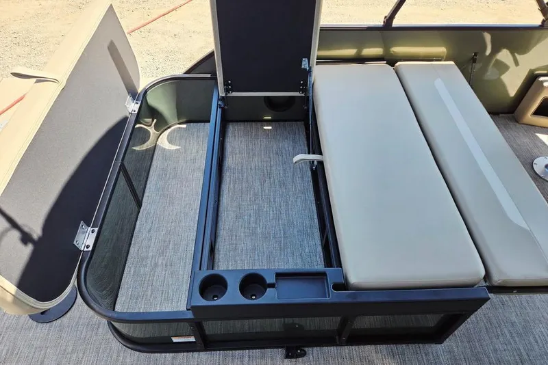 Slide: The Image of 2025 Godfrey Xperience 2086 SFLX boat interior with seating and storage compartments. - 14