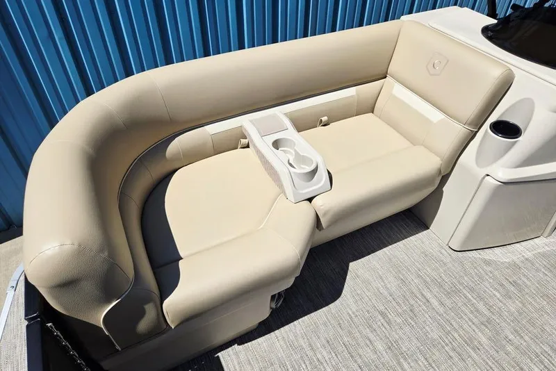 Slide: The Image of Luxurious seating on 2025 Godfrey Xperience 2086 SFLX boat, featuring beige upholstery and cup holders. - 15