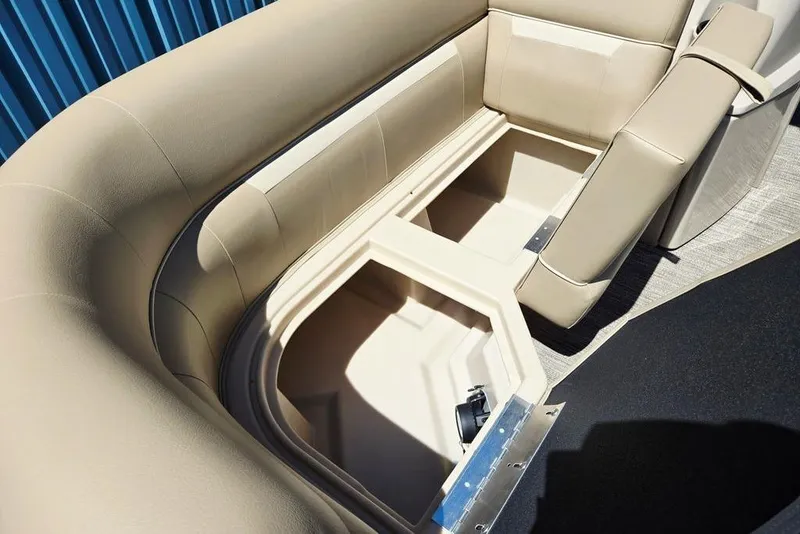 Slide: The Image of 2025 Godfrey Xperience 2086 SFLX boat interior storage compartment with beige seating. - 18