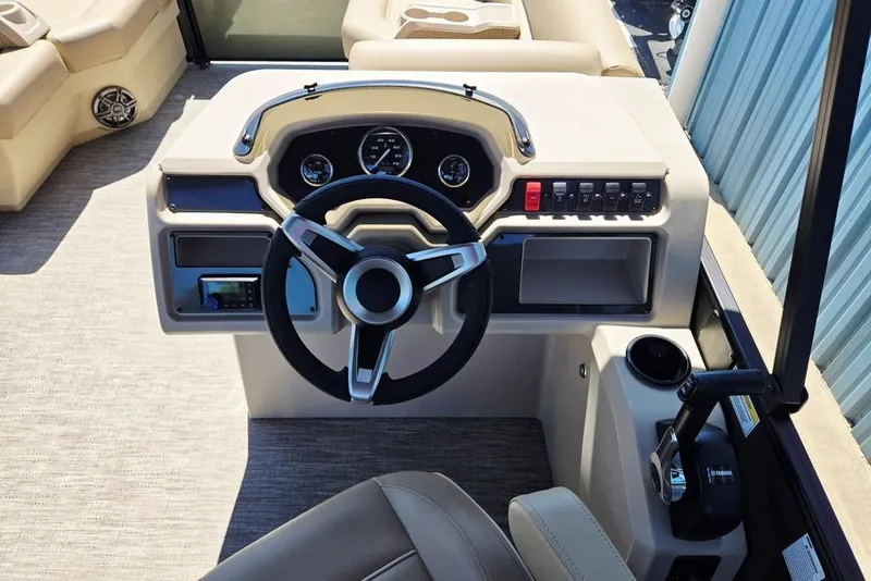 Slide: The Image of 2025 Godfrey Xperience 2086 SFLX boat dashboard with steering wheel and controls. - 26