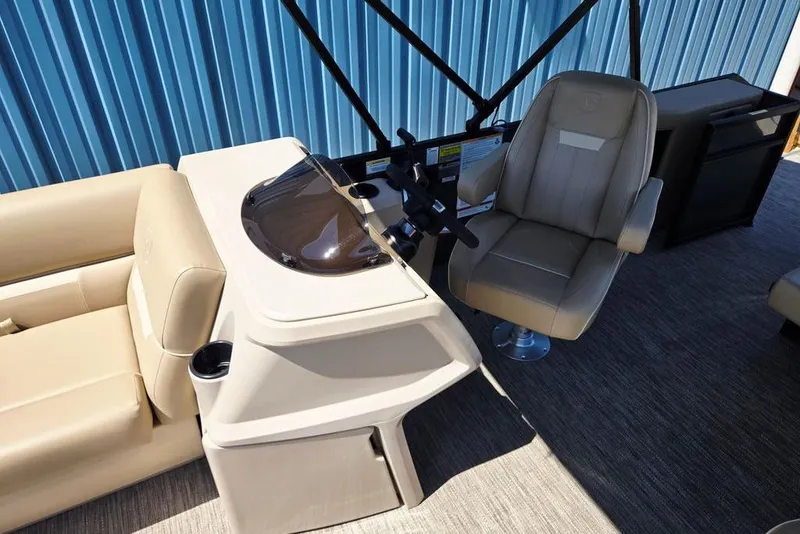 Slide: The Image of 2025 Godfrey Xperience 2086 SFLX boat interior with helm and seating. - 28