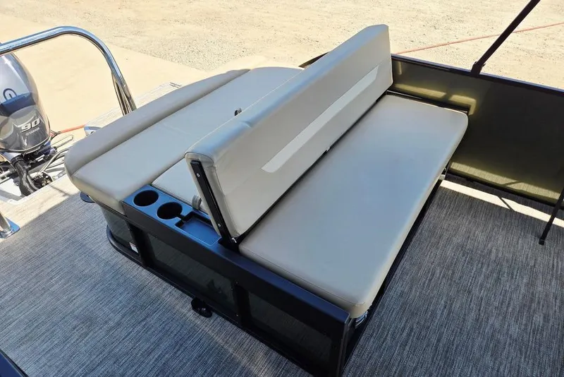 Slide: The Image of 2025 Godfrey Xperience 2086 SFLX boat seating with cup holders and motor view. - 29