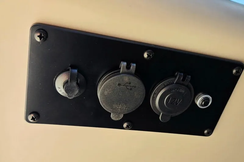 Slide: The Image of Control panel with USB and 12V marine outlets on 2025 Godfrey Xperience 2086 SFLX. - 32