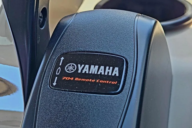 Slide: The Image of Close-up of Yamaha 704 remote control on 2025 Godfrey Xperience 2086 SFLX boat. - 35