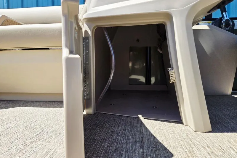 Slide: The Image of Interior view of 2025 Godfrey Xperience 2086 SFLX boat, showcasing storage compartment. - 38