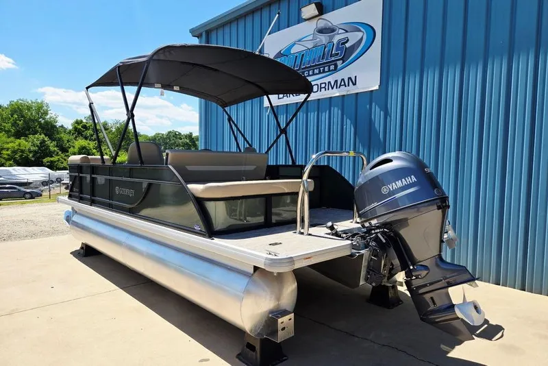 Slide: The Image of 2025 Godfrey Xperience 2086 SFLX pontoon boat with Yamaha motor, parked outside dealership. - 6