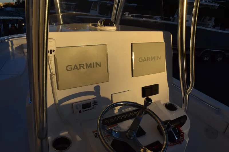Slide: The Image of 2023 Contender 24 Sport boat console with Garmin navigation systems. - 10