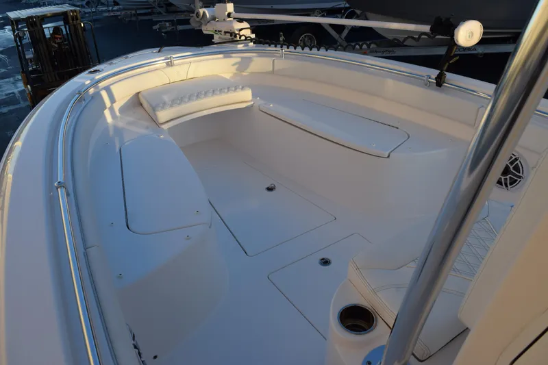 Slide: The Image of 2023 Contender 24 Sport boat interior with seating and storage compartments. - 13