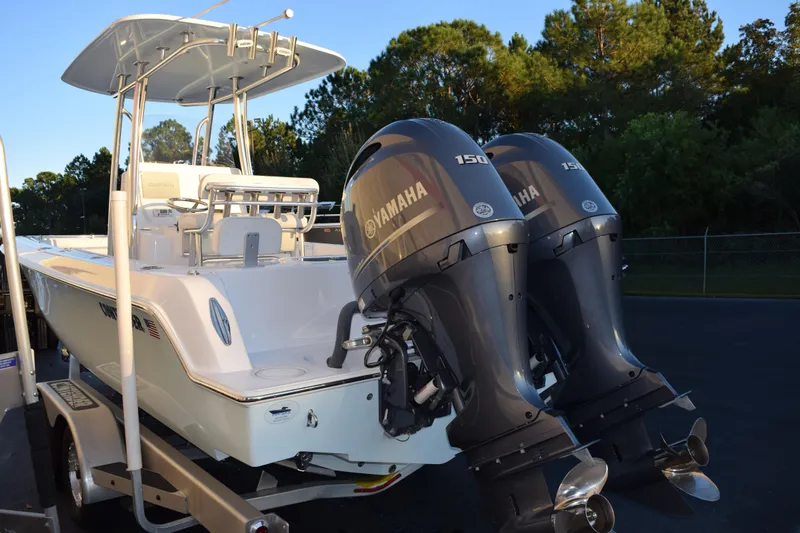 Slide: The Image of 2023 Contender 24 Sport boat with dual Yamaha 150 engines on a trailer. - 6
