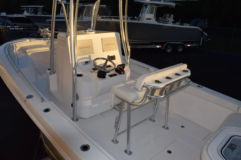 Slide: The Image of 2023 Contender 24 Sport boat interior with Garmin electronics and seating. - 7
