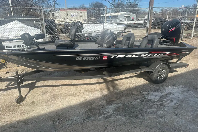 The Image of 2023 Tracker Pro Team 190 TX fishing boat on trailer, parked outdoors. - 0