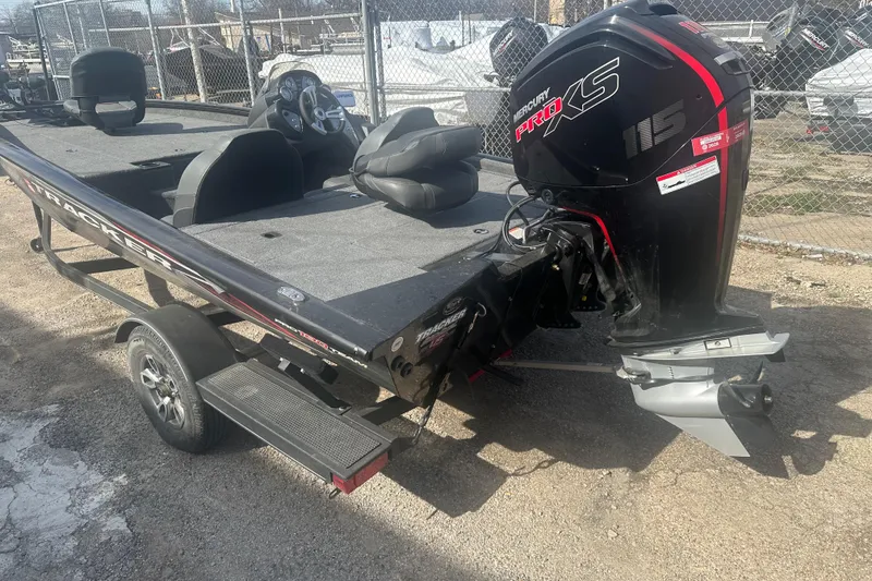 Slide: The Image of 2023 Tracker Pro Team 190 TX boat with Mercury Pro XS engine, parked on a trailer. - 13