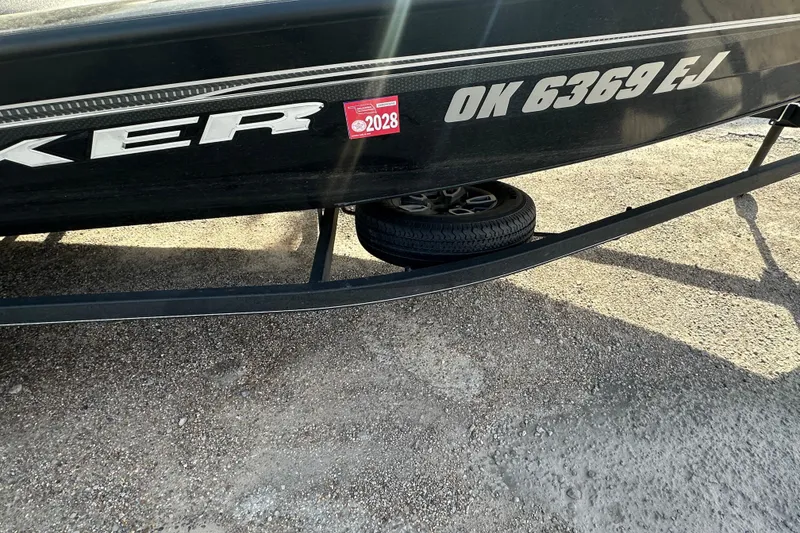 Slide: The Image of 2023 Tracker Pro Team 190 TX boat on trailer, registration OK 6369 EJ. - 6