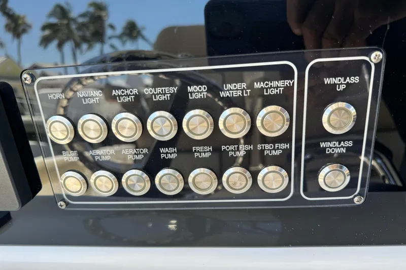 Slide: The Image of Control panel of a 2017 Sea Fox 288 Commander boat with labeled buttons. - 16