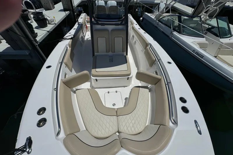 Slide: The Image of 2017 Sea Fox 288 Commander boat with beige seating and spacious deck layout. - 17