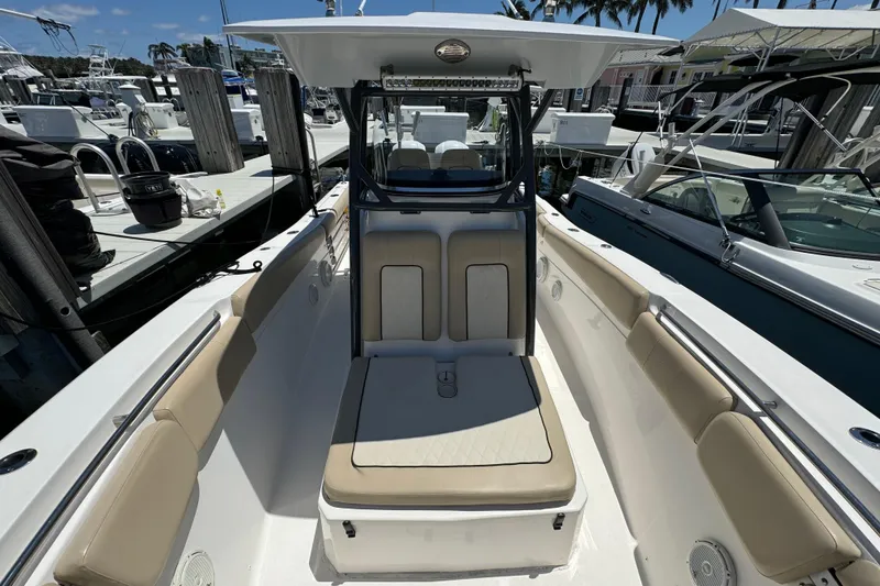 Slide: The Image of 2017 Sea Fox 288 Commander boat interior with seating, docked at marina. - 20