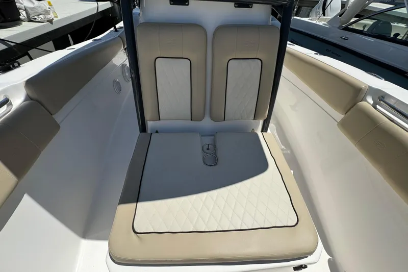 Slide: The Image of 2017 Sea Fox 288 Commander boat seating area with beige cushions and diamond stitching. - 21