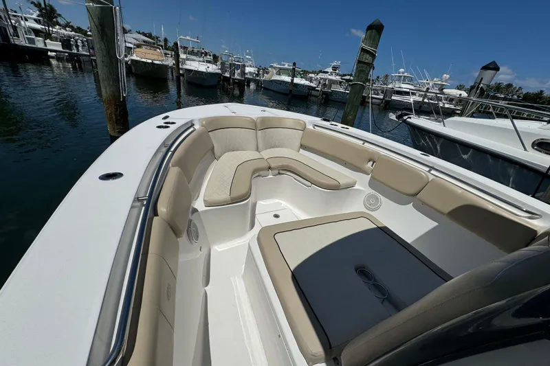 Slide: The Image of 2017 Sea Fox 288 Commander boat with spacious seating at a marina. - 22